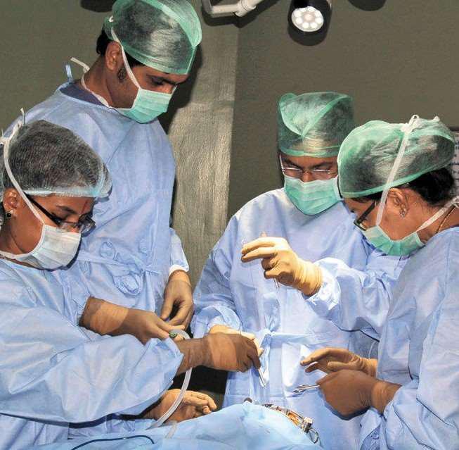 From left to right, Dr. Krishna Shama Rao (third) is seen operating.